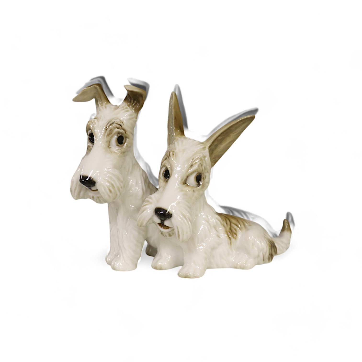 A group of two Hutschereuther grotesque terriers, 13.5cm high. Condition - good